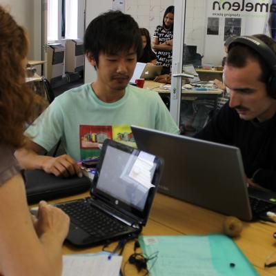 A group of Projects Abroad journalism interns at work Journalism interns in South Africa